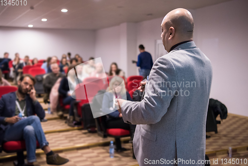 Image of successful businessman giving presentations at conference room