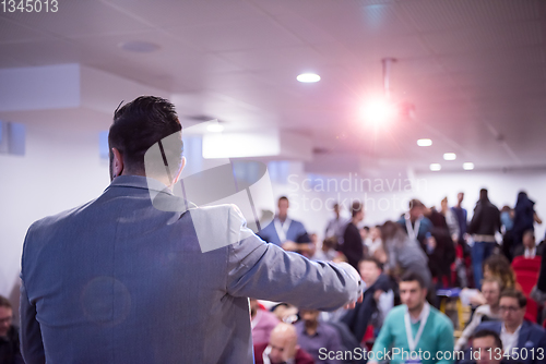 Image of successful businessman giving presentations at conference room