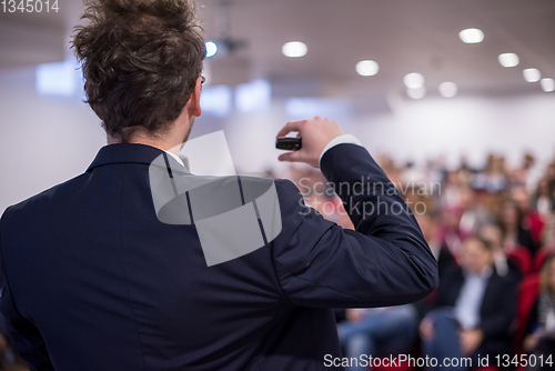 Image of successful businessman giving presentations at conference room