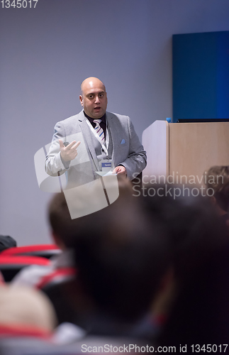 Image of successful businessman giving presentations at conference room