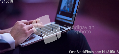 Image of business people hands using laptop computer