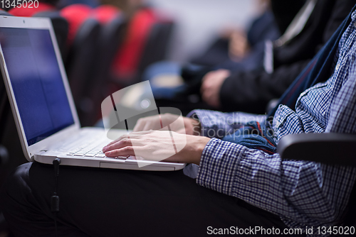 Image of business people hands using laptop computer