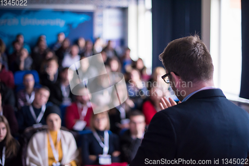 Image of successful businessman giving presentations at conference room