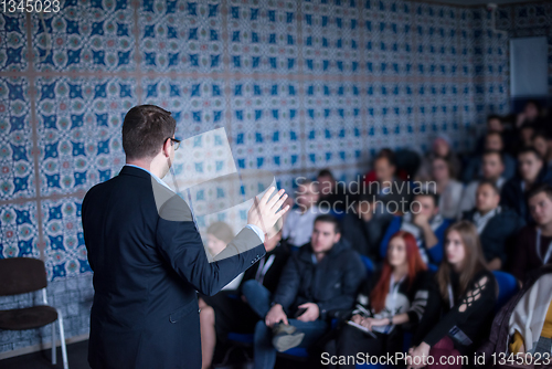 Image of successful businessman giving presentations at conference room