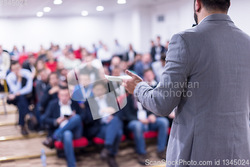 Image of successful businessman giving presentations at conference room