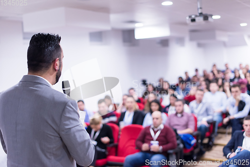 Image of successful businessman giving presentations at conference room