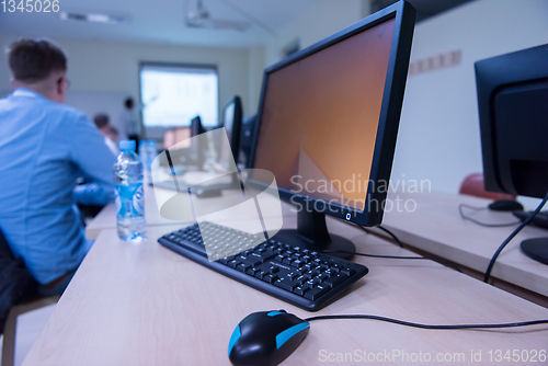 Image of businessman working using a computer in startup office