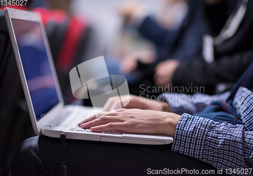 Image of business people hands using laptop computer