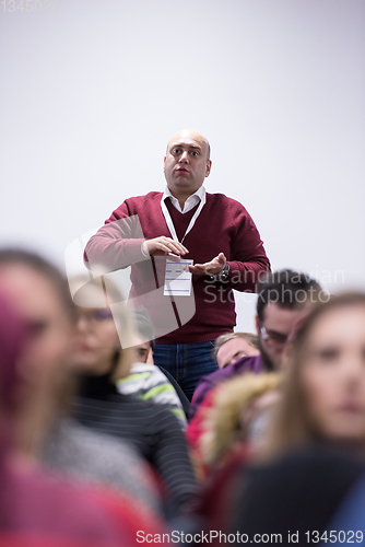 Image of successful businessman giving presentations at conference room