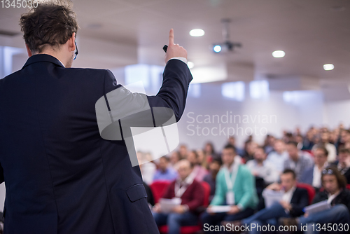 Image of successful businessman giving presentations at conference room