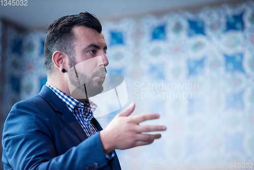 Image of successful businessman giving presentations at conference room