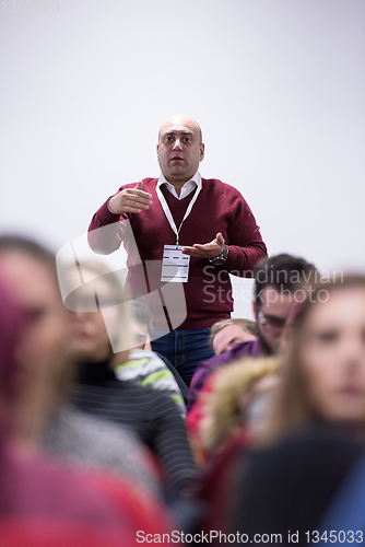 Image of successful businessman giving presentations at conference room