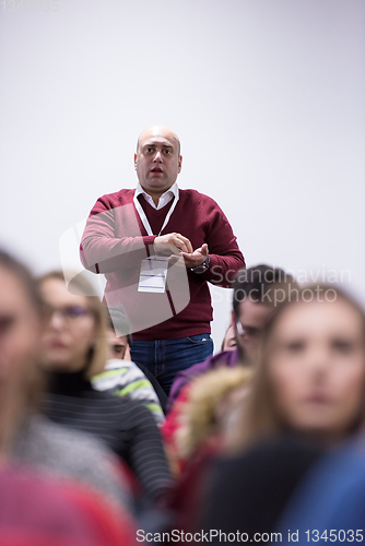 Image of successful businessman giving presentations at conference room