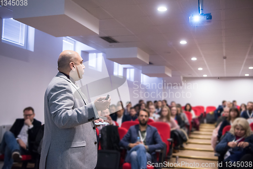 Image of successful businessman giving presentations at conference room