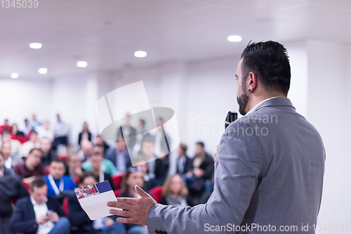 Image of successful businessman giving presentations at conference room