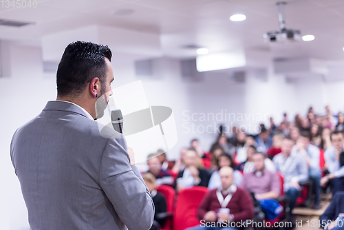 Image of successful businessman giving presentations at conference room