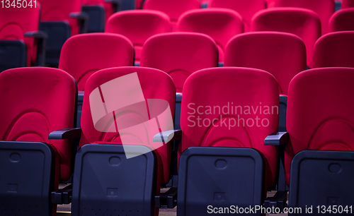 Image of hall with rows of red seats