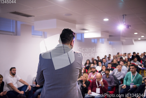 Image of successful businessman giving presentations at conference room