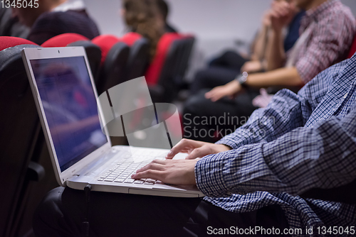 Image of business people hands using laptop computer