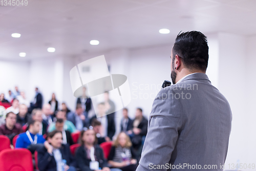 Image of successful businessman giving presentations at conference room