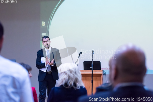 Image of successful businessman giving presentations at conference room