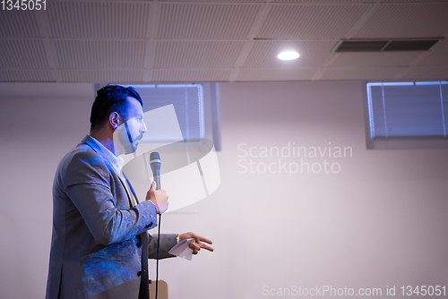 Image of successful businessman giving presentations at conference room