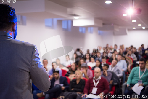 Image of successful businessman giving presentations at conference room