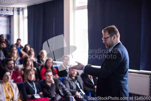 Image of successful businessman giving presentations at conference room