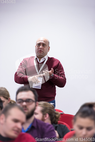 Image of successful businessman giving presentations at conference room