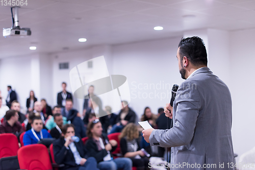 Image of successful businessman giving presentations at conference room