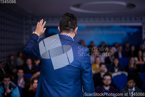 Image of successful businessman giving presentations at conference room