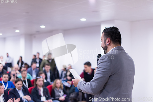 Image of successful businessman giving presentations at conference room