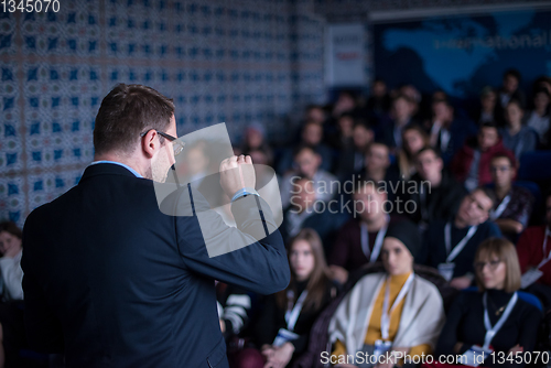 Image of successful businessman giving presentations at conference room