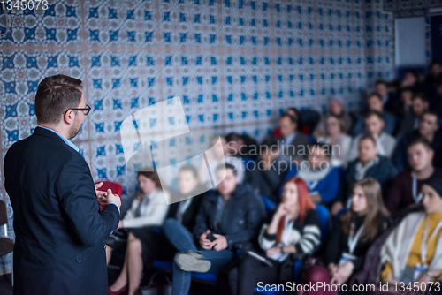 Image of successful businessman giving presentations at conference room