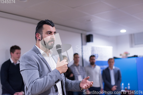 Image of successful businessman giving presentations at conference room