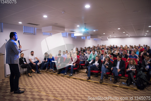 Image of successful businessman giving presentations at conference room