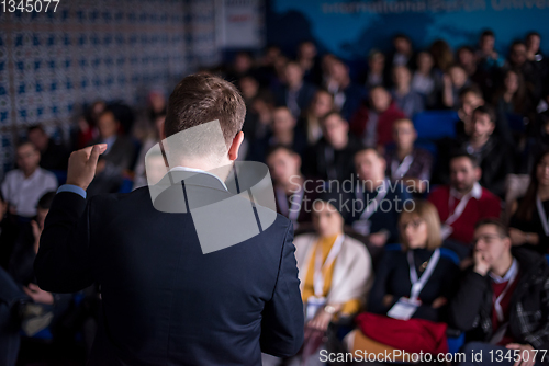 Image of successful businessman giving presentations at conference room