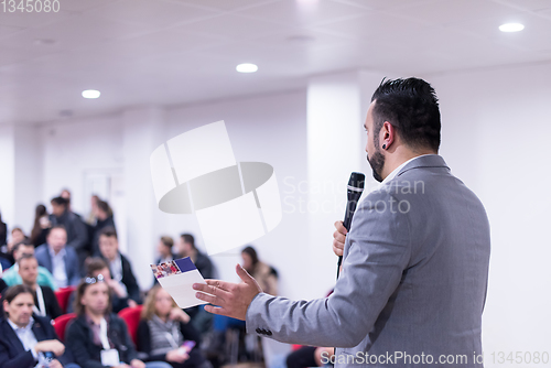 Image of successful businessman giving presentations at conference room