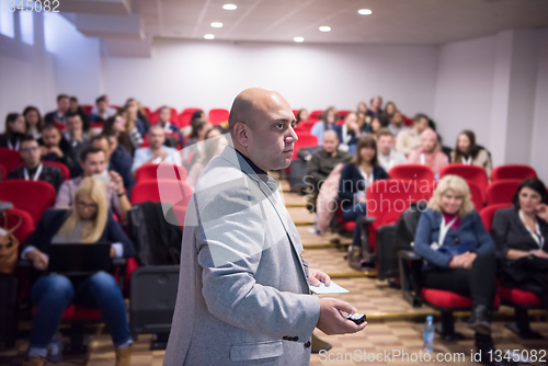 Image of successful businessman giving presentations at conference room