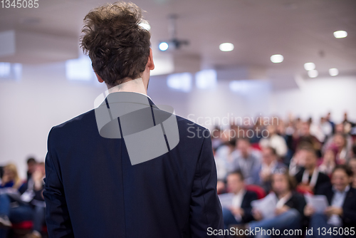 Image of successful businessman giving presentations at conference room