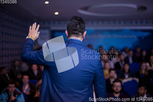 Image of successful businessman giving presentations at conference room