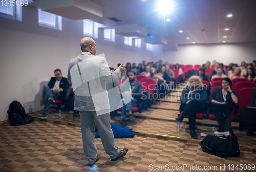 Image of successful businessman giving presentations at conference room