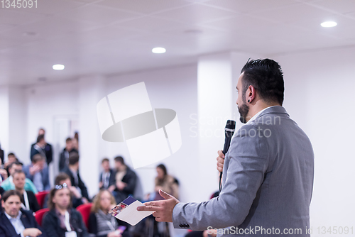 Image of successful businessman giving presentations at conference room