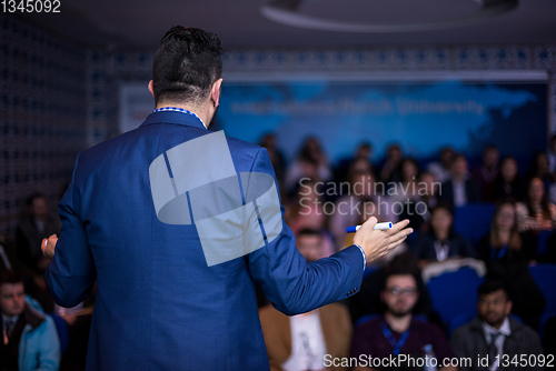 Image of successful businessman giving presentations at conference room