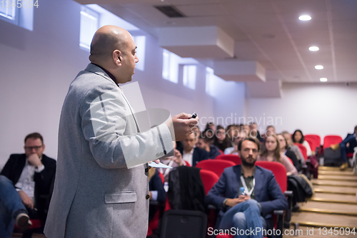 Image of successful businessman giving presentations at conference room