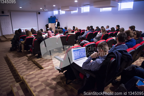 Image of successful businessman giving presentations at conference room