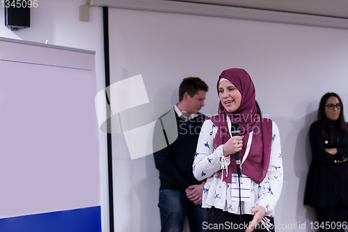 Image of Muslim businesswoman giving presentations