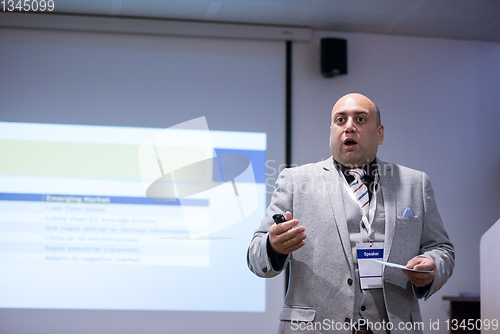 Image of successful businessman giving presentations at conference room