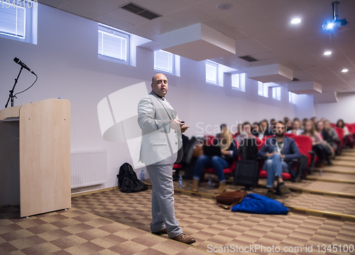 Image of successful businessman giving presentations at conference room