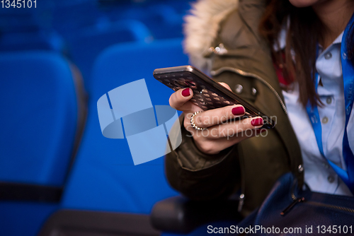 Image of casual business woman hand using smart phone